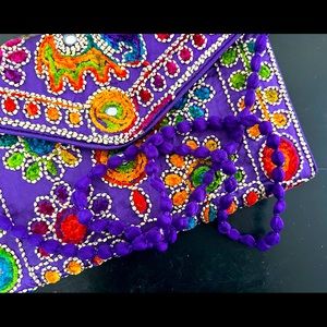 New embroidery and mirror detailed clutch